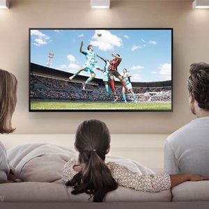 Family watching streaming tv in home